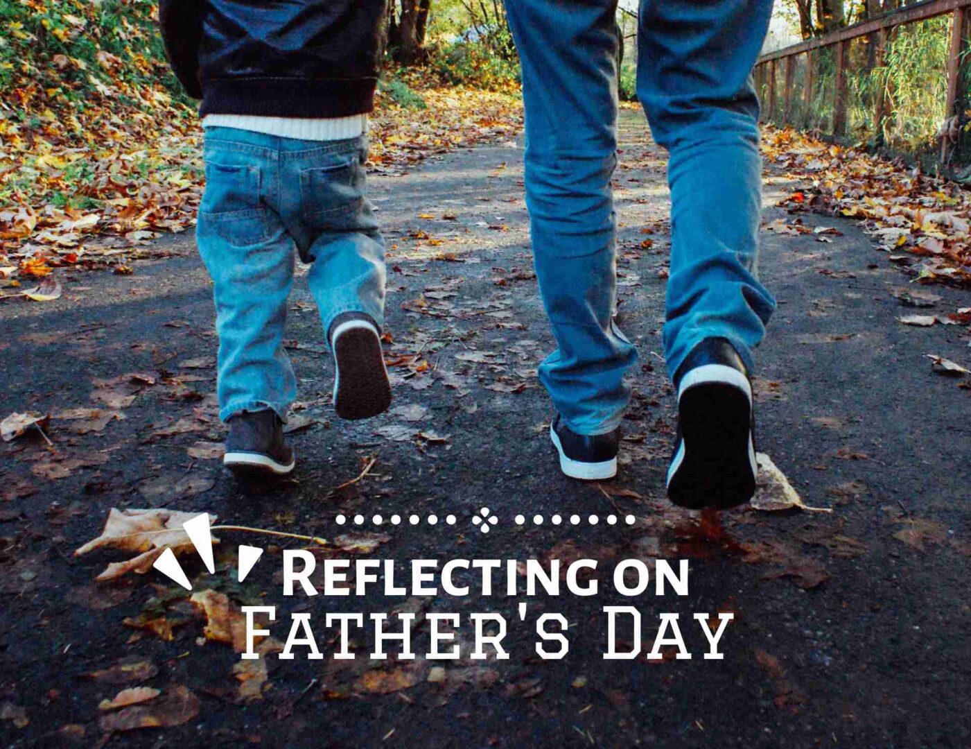 A Father walking with his child in Autumn.