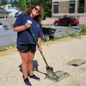 A volunteer with a rake