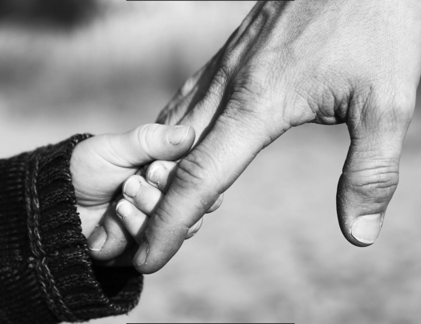 Father-holding-child's-hand